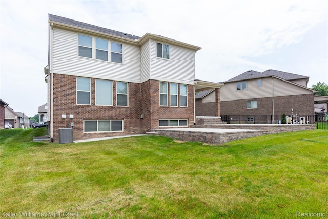24738 Callaway Dr, Macomb, MI 48042 - rear view of house featuring brick siding and a patio area