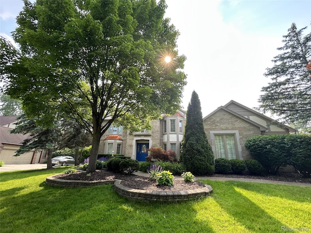 4567 Odette Ct, Troy, MI 48098 - view of front of property featuring brick siding and a front lawn