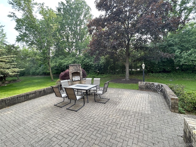 4567 Odette Ct, Troy, MI 48098 - view of patio featuring exterior fireplace and outdoor dining space