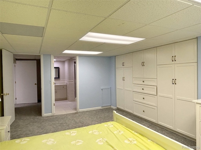 4567 Odette Ct, Troy, MI 48098 - carpeted bedroom featuring a drop ceiling, a closet, and ensuite bathroom