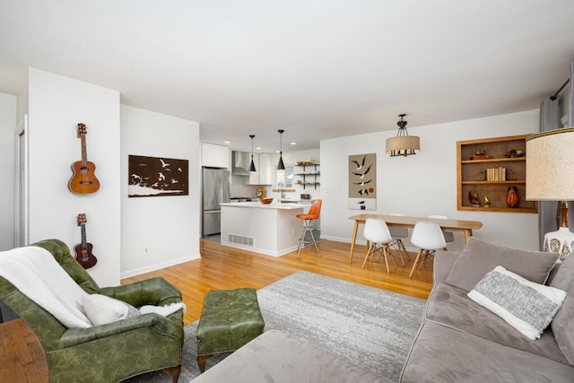 2534 Pamela Ave, Ann Arbor, MI 48103 - living area featuring light wood-style flooring and baseboards