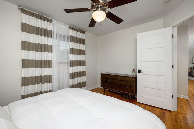 2534 Pamela Ave, Ann Arbor, MI 48103 - bedroom with wood finished floors, baseboards, and a ceiling fan
