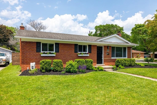 2534 Pamela Ave, Ann Arbor, MI 48103 - ranch-style house with a chimney, brick siding, a front lawn, and roof with shingles