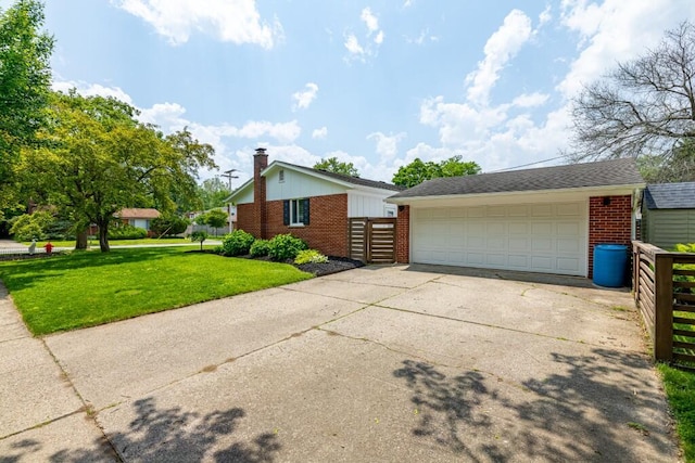 2534 Pamela Ave, Ann Arbor, MI 48103 - view of side of property with brick siding, a chimney, and a detached garage