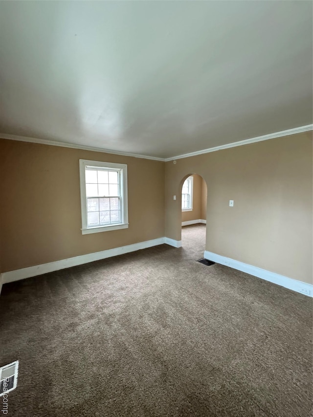 244 Nelson St, Pontiac, MI 48342 - carpeted spare room with arched walkways, healthy amount of natural light, crown molding, and baseboards
