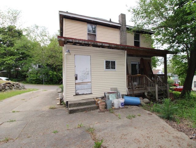 203 W Belmont St, Kalamazoo, MI 49001 - rear view of house with a chimney