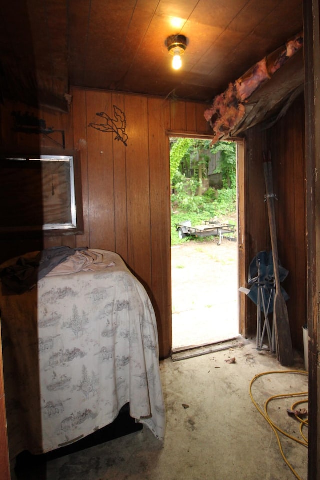 203 W Belmont St, Kalamazoo, MI 49001 - bedroom featuring wooden walls and access to exterior