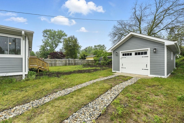 340 N Berrien St, New Buffalo, MI 49117 - view of yard with driveway, a garage, and an outbuilding