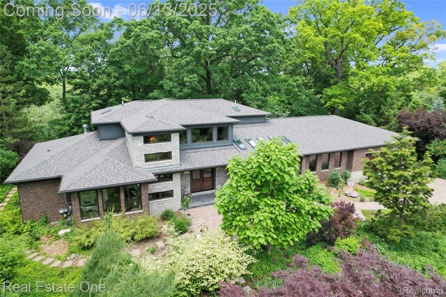 15349 Lakeside St, Plymouth, MI 48170 - prairie-style home featuring roof with shingles, stone siding, and brick siding