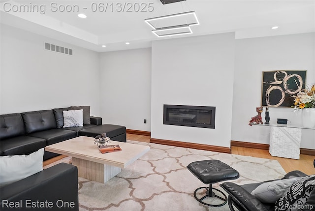 15349 Lakeside St, Plymouth, MI 48170 - living room with wood finished floors, recessed lighting, and a glass covered fireplace