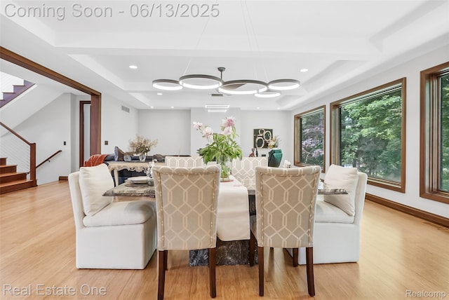 15349 Lakeside St, Plymouth, MI 48170 - dining room with stairs, light wood-style floors, and a tray ceiling