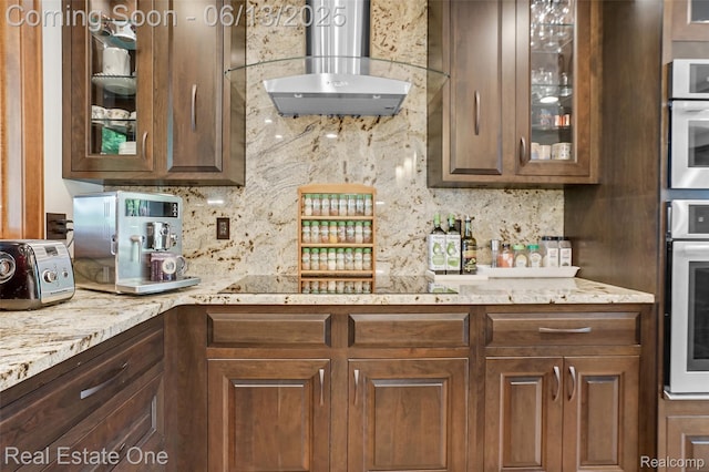 15349 Lakeside St, Plymouth, MI 48170 - kitchen featuring wall chimney range hood, tasteful backsplash, stainless steel oven, and glass insert cabinets