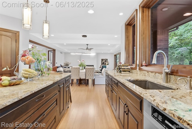15349 Lakeside St, Plymouth, MI 48170 - kitchen with dishwashing machine, light stone counters, recessed lighting, hanging light fixtures, and a tray ceiling