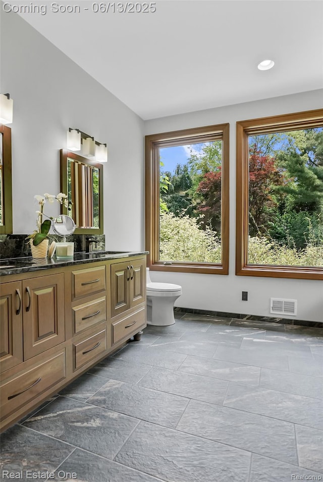 15349 Lakeside St, Plymouth, MI 48170 - bathroom featuring vanity, stone tile floors, and recessed lighting
