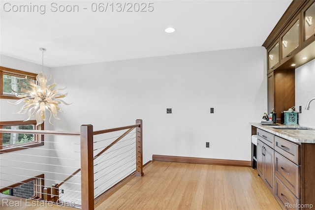 15349 Lakeside St, Plymouth, MI 48170 - kitchen with a chandelier, light wood-type flooring, light countertops, healthy amount of natural light, and recessed lighting