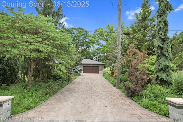15349 Lakeside St, Plymouth, MI 48170 - view of front of home featuring a garage and driveway