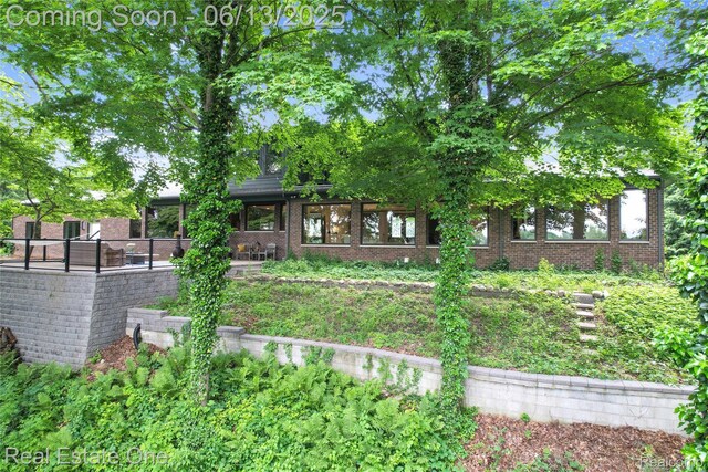 15349 Lakeside St, Plymouth, MI 48170 - view of front of house with brick siding and a patio area