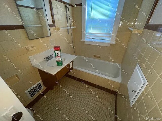 2307 Monteith St, Flint, MI 48504 - bathroom featuring vanity and tile walls