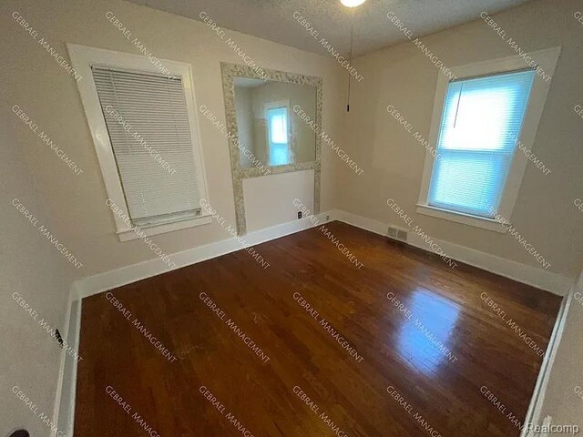 2307 Monteith St, Flint, MI 48504 - unfurnished room with wood finished floors and baseboards