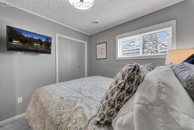 2968 Wolverine Rd, East Tawas, MI 48730 - carpeted bedroom featuring crown molding and a closet