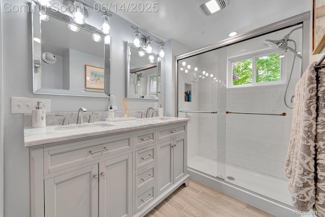 2968 Wolverine Rd, East Tawas, MI 48730 - full bath featuring a shower stall and double vanity