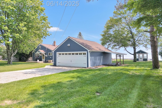 2968 Wolverine Rd, East Tawas, MI 48730 - view of front facade featuring a front lawn and driveway