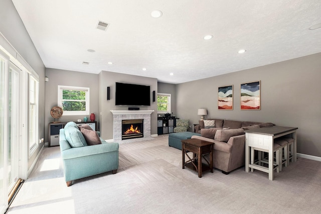 6526 Ada Dr SE, Ada, MI 49301 - living room featuring light carpet, a brick fireplace, recessed lighting, and baseboards