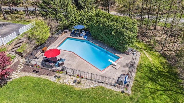 6526 Ada Dr SE, Ada, MI 49301 - view of swimming pool featuring a diving board and a patio area
