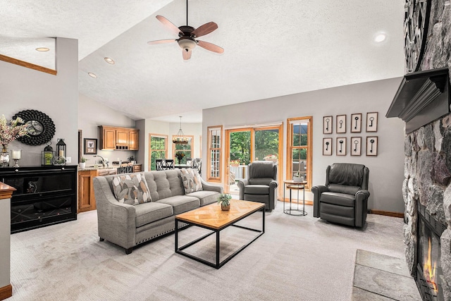 6526 Ada Dr SE, Ada, MI 49301 - living area featuring a textured ceiling, light colored carpet, lofted ceiling, a ceiling fan, and a stone fireplace