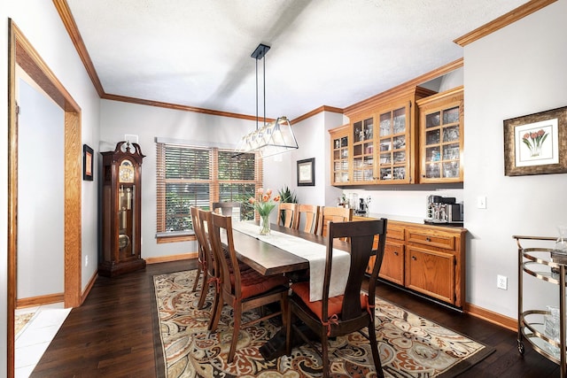6526 Ada Dr SE, Ada, MI 49301 - dining space featuring dark wood finished floors, baseboards, and crown molding