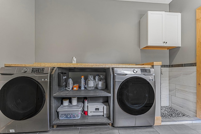 9725 Green Briar Rd, Lake Ann, MI 49650 - washroom featuring independent washer and dryer and tile patterned floors