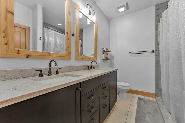 9725 Green Briar Rd, Lake Ann, MI 49650 - bathroom featuring double vanity, tile patterned floors, and curtained shower