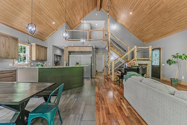 9725 Green Briar Rd, Lake Ann, MI 49650 - living room with high vaulted ceiling, wood ceiling, stairway, dark wood-style floors, and recessed lighting
