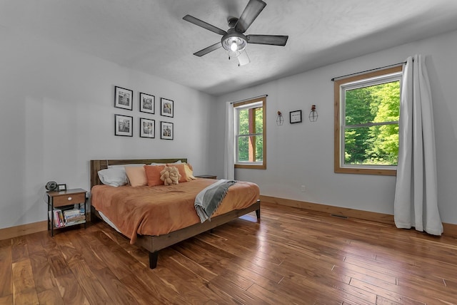9725 Green Briar Rd, Lake Ann, MI 49650 - bedroom with wood-type flooring and a ceiling fan