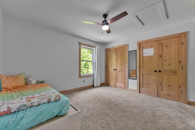 9725 Green Briar Rd, Lake Ann, MI 49650 - bedroom with carpet, two closets, and a ceiling fan
