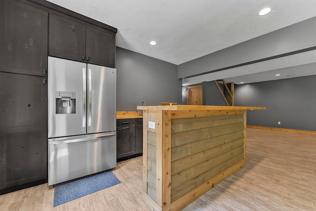 9725 Green Briar Rd, Lake Ann, MI 49650 - kitchen featuring stainless steel fridge with ice dispenser, light wood-style floors, butcher block countertops, and recessed lighting