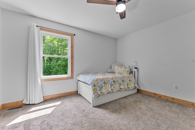 9725 Green Briar Rd, Lake Ann, MI 49650 - bedroom with light carpet and a ceiling fan