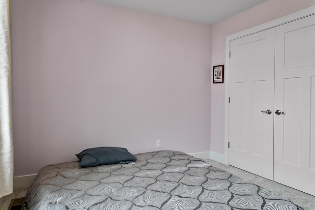 55135 Hanford Ct, Utica, MI 48316 - unfurnished bedroom with carpet flooring, a closet, and baseboards