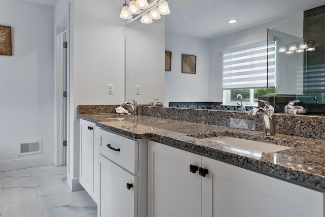 55135 Hanford Ct, Utica, MI 48316 - bathroom with double vanity, marble finish flooring, recessed lighting, and a chandelier