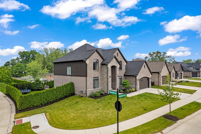 55135 Hanford Ct, Utica, MI 48316 - french country style house featuring brick siding, concrete driveway, and a garage