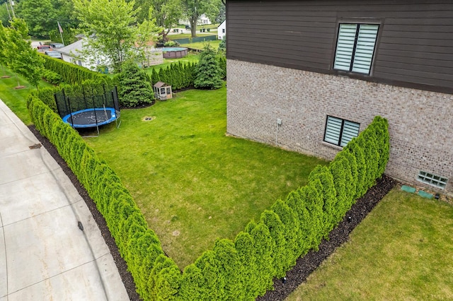 55135 Hanford Ct, Utica, MI 48316 - view of green lawn featuring a trampoline