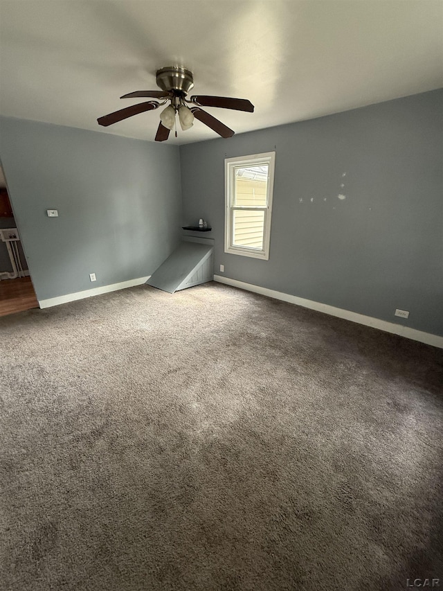 212 W Union St, Morenci, MI 49256 - empty room featuring baseboards, a ceiling fan, and carpet flooring