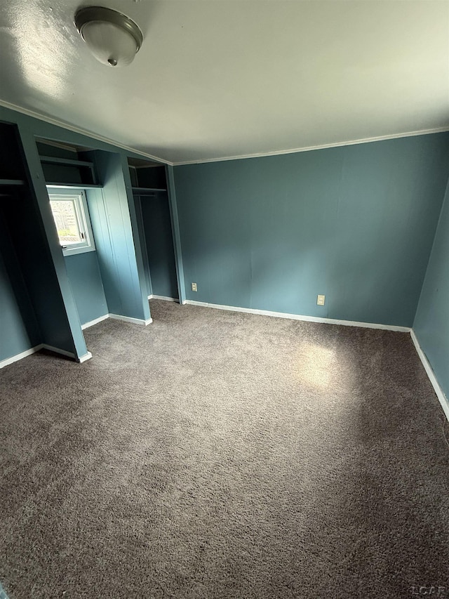 212 W Union St, Morenci, MI 49256 - unfurnished bedroom featuring crown molding, baseboards, carpet flooring, and a closet