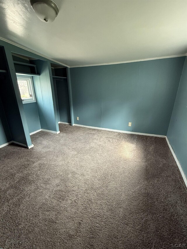 212 W Union St, Morenci, MI 49256 - unfurnished bedroom featuring ornamental molding, carpet, baseboards, and a closet