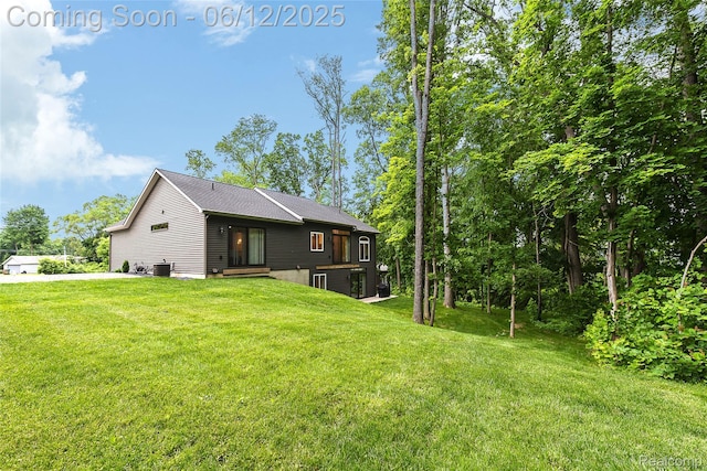 10327 9 Mile Rd, Whitmore Lake, MI 48189 - back of property featuring a yard