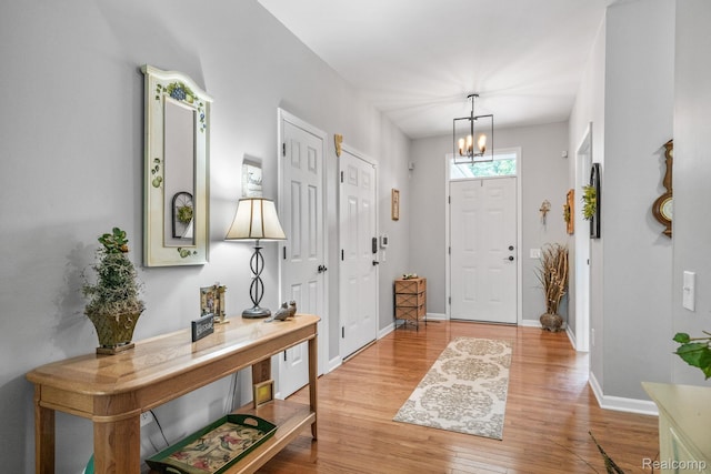 1156 Fairway Dr, Pontiac, MI 48340 - foyer featuring light wood-style flooring and a chandelier