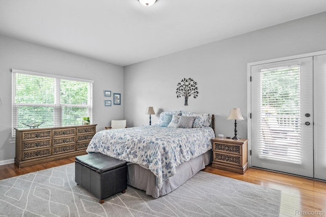 1156 Fairway Dr, Pontiac, MI 48340 - bedroom featuring access to exterior and wood finished floors
