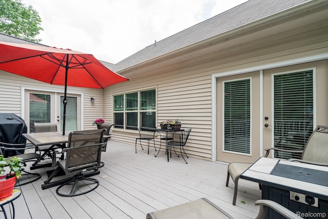 1156 Fairway Dr, Pontiac, MI 48340 - wooden deck featuring outdoor dining space and a grill