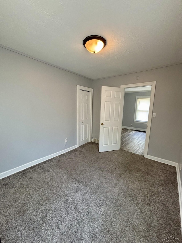 2138 N Clinton St, Saginaw, MI 48602 - spare room with carpet floors and baseboards