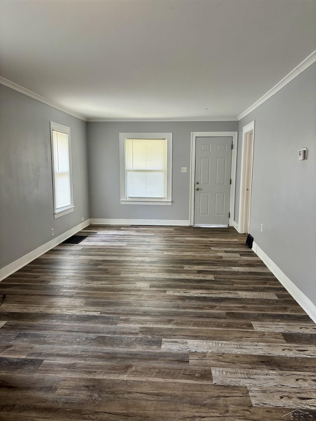 2138 N Clinton St, Saginaw, MI 48602 - foyer featuring ornamental molding, dark wood finished floors, and baseboards